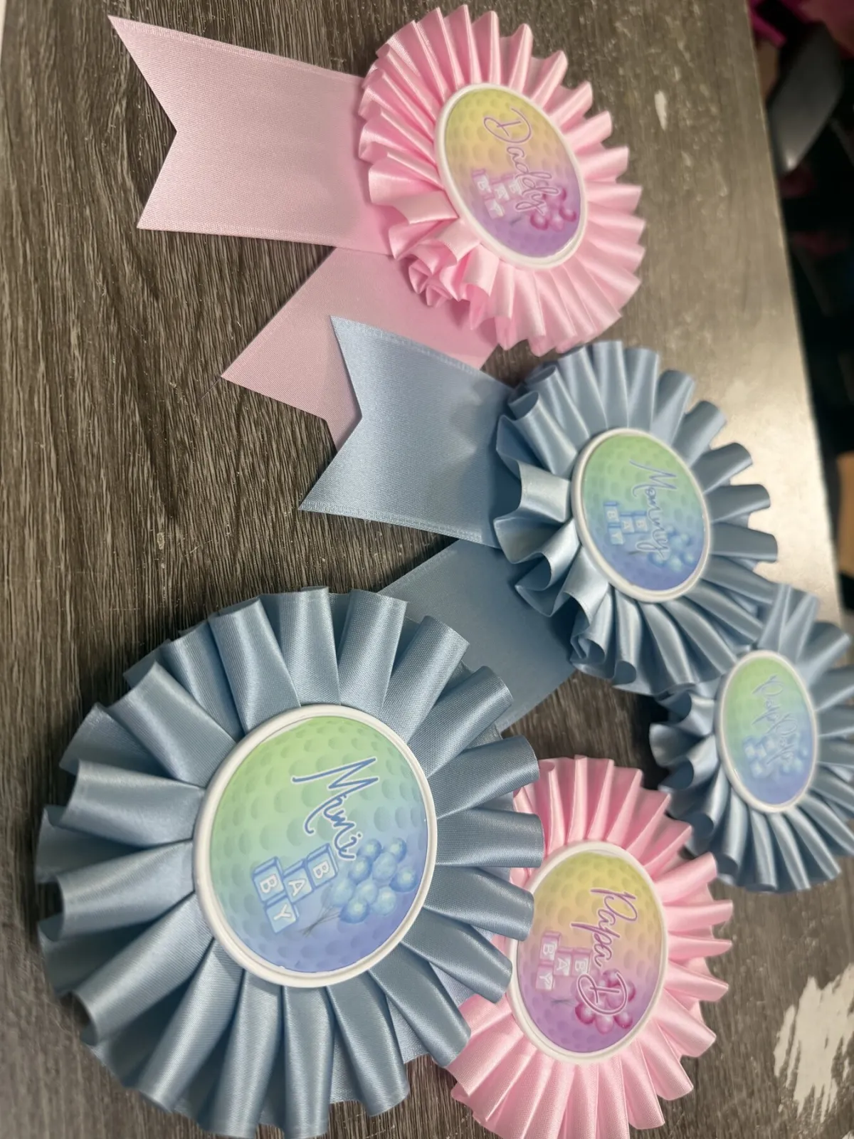 Pastel pink and blue custom rosettes made by Ribbon Crafters